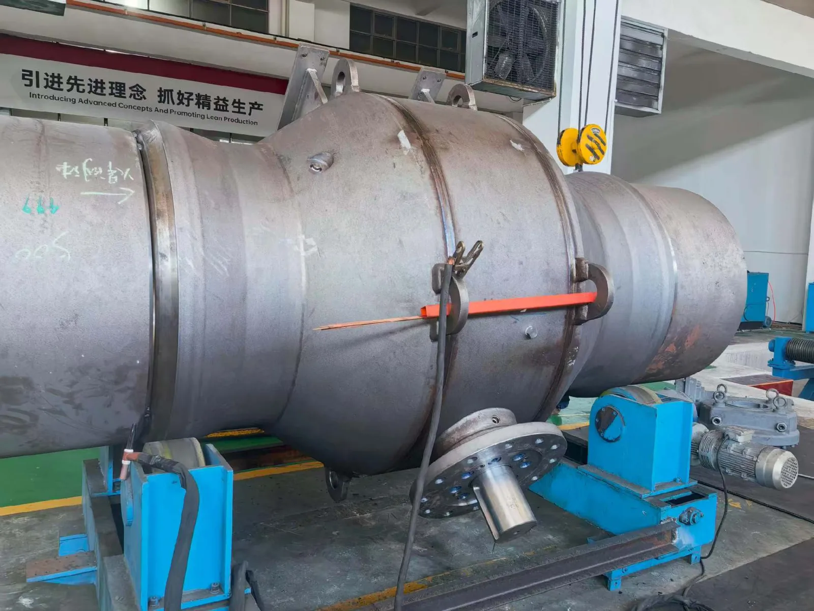 Large industrial ball valves arranged in a production workshop