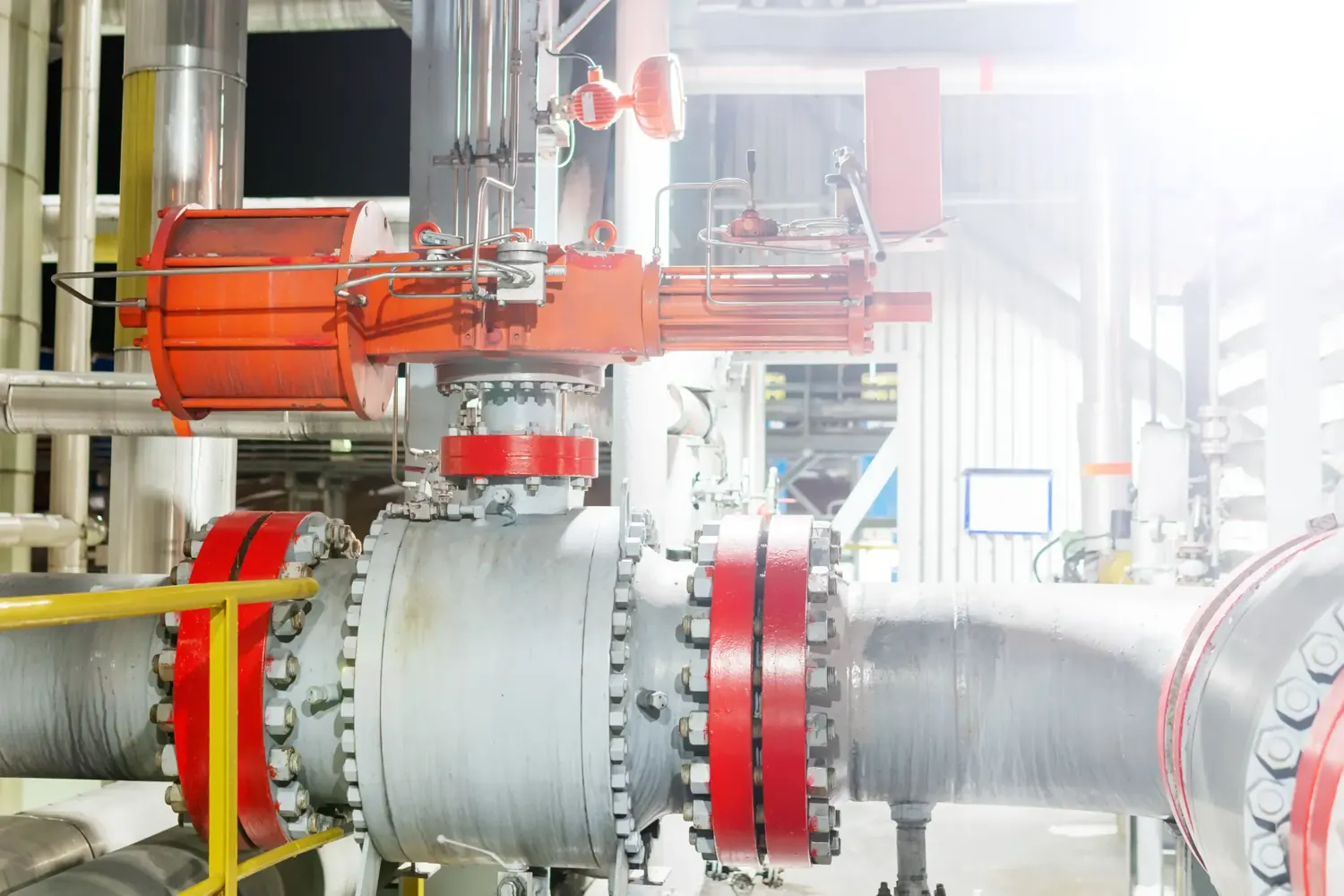 Actuated industrial ball valve installed in a pipe system